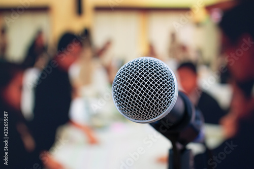 Seminar Conference Concept : Close-up Microphones on abstract blurred of speech in meeting room, front speaking blur people in event convention hall in hotel background