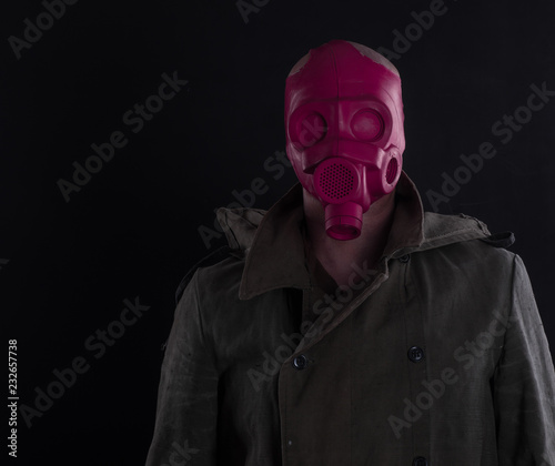 a man in a red gas mask
