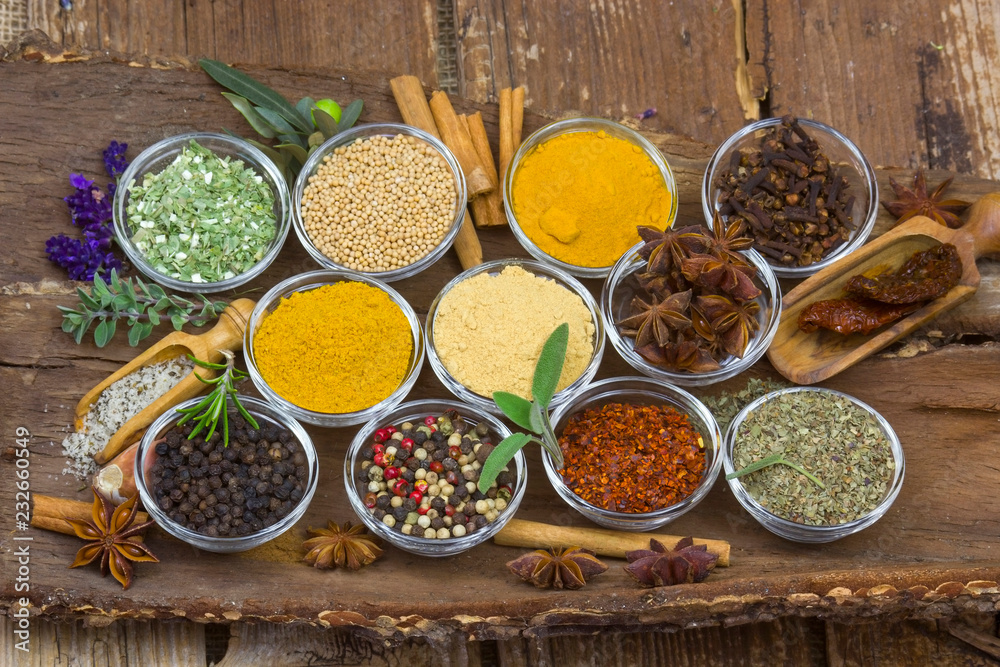 Variety of spices on wooden background Variety of spices on wooden background