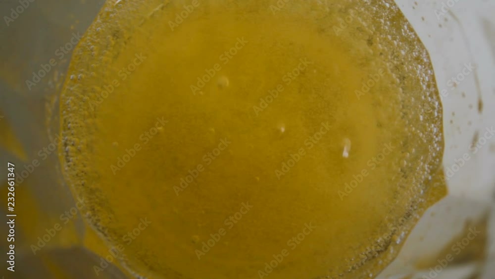 Top view of orange effervescent tablet Top view of orange effervescent tablet