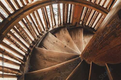 old retro wooden spiral staircase in the ancient bell tower of the Orthodox Church in Russia. Vologda
