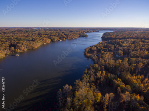Aerial View of Fall Leaves and Colors around a Lake