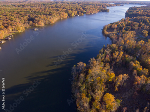 Aerial View of Fall Leaves and Colors around a Lake