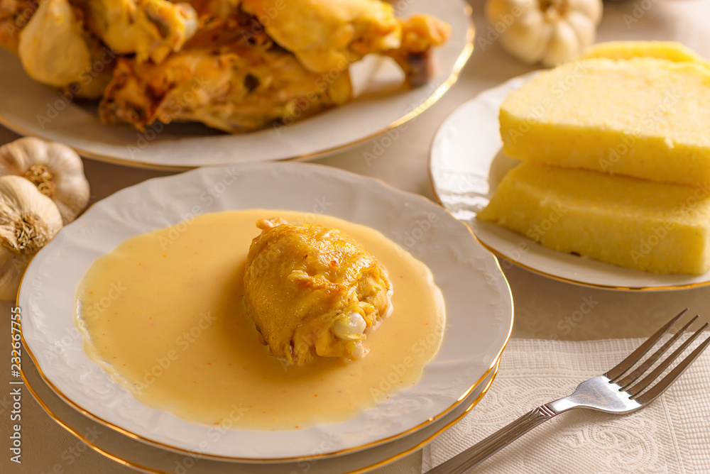 Caucasian cuisine. Circassian (Adyghe) traditional folk dish. Boiled chicken with sour cream sauce (djedlibje) Served with pasta (millet dish) Caucasian cuisine. Circassian (Adyghe) traditional folk dish. Boiled chicken with sour cream sauce (djedlibje) Served with pasta (millet dish)