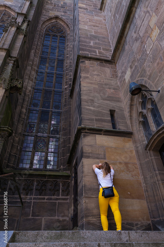 Girl near the German Church with protest poses