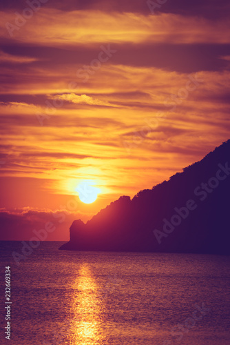Sunrise or sunset over sea surface
