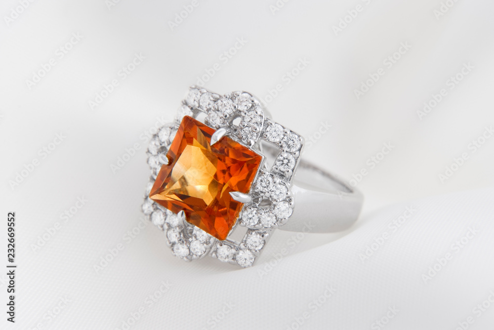 White Gold Ring With Citrine And Diamonds On Soft White Background White Gold Ring With Citrine And Diamonds On Soft White Background