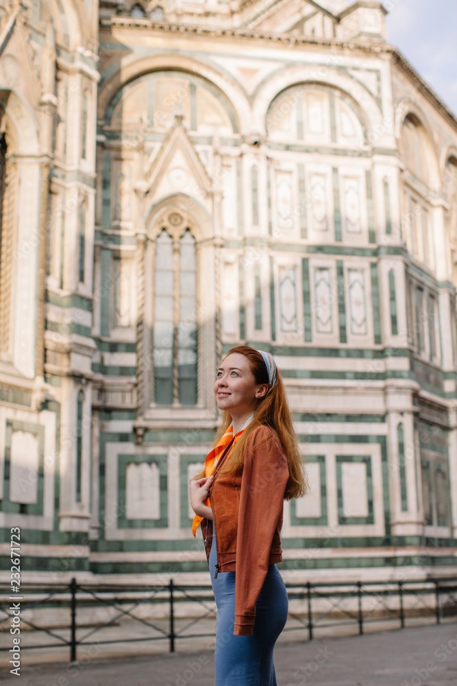 Happy girl walking by Florence street Happy girl walking by Florence street