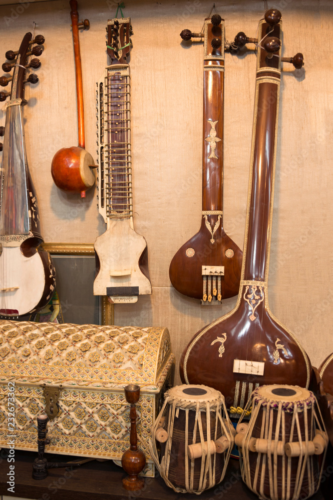 Indian musical instruments stringed guitars called sitars and Indian