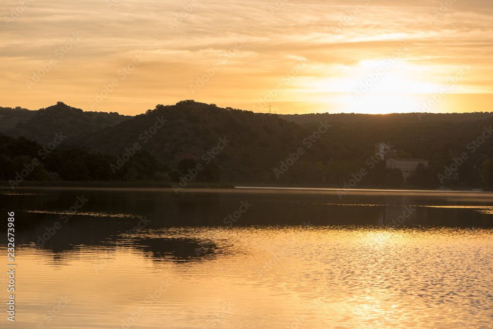 Sunset in the ruidera lagoons with the golden sky