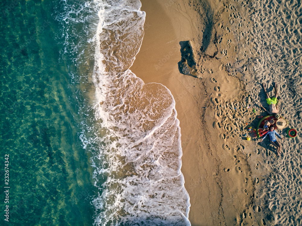 Beautiful beach with family top view shot Beautiful beach with family top view shot