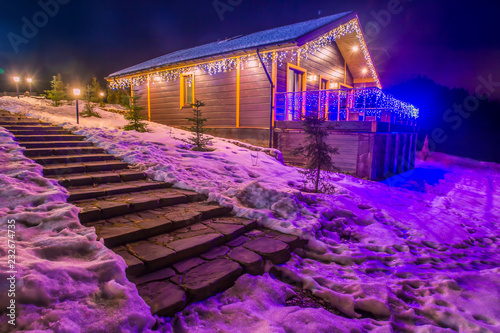 Winter. The house is decora...