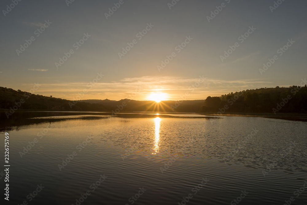 Sunset in the ruidera lagoons with the golden sky