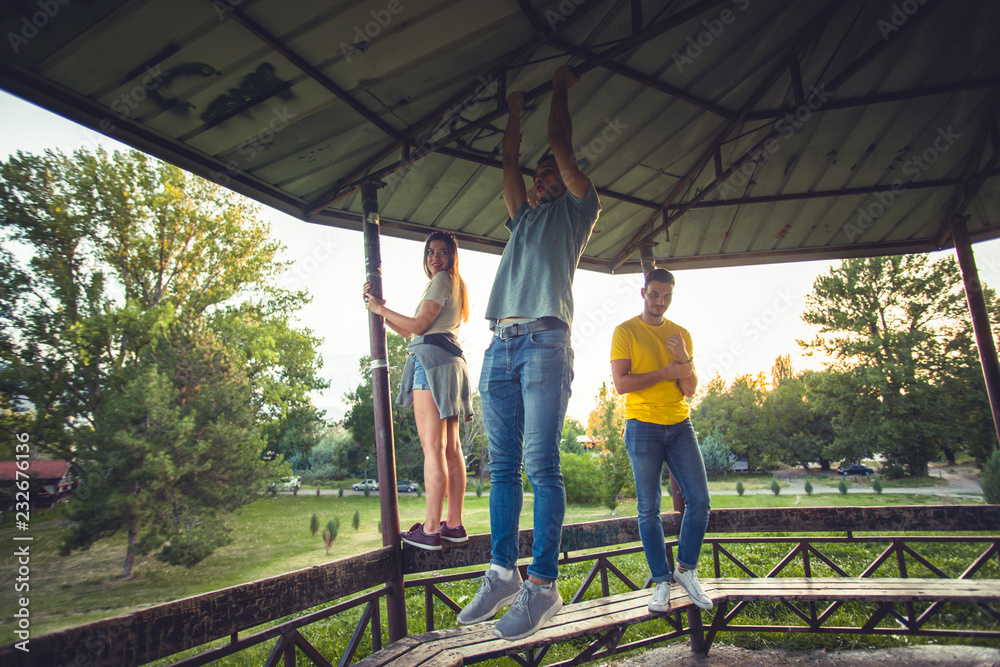 Friends standing on wooden boards Friends standing on wooden boards