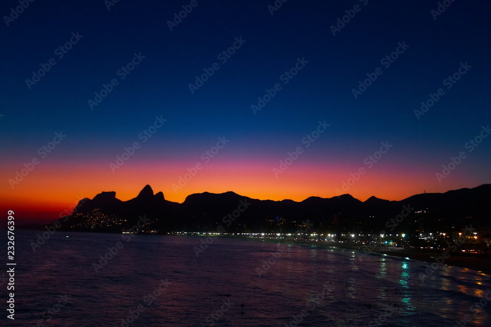 Dusk over the beaches of Ipanema and Leblon in Rio de Janeiro (Brazil) with Two Brothers hill in the background