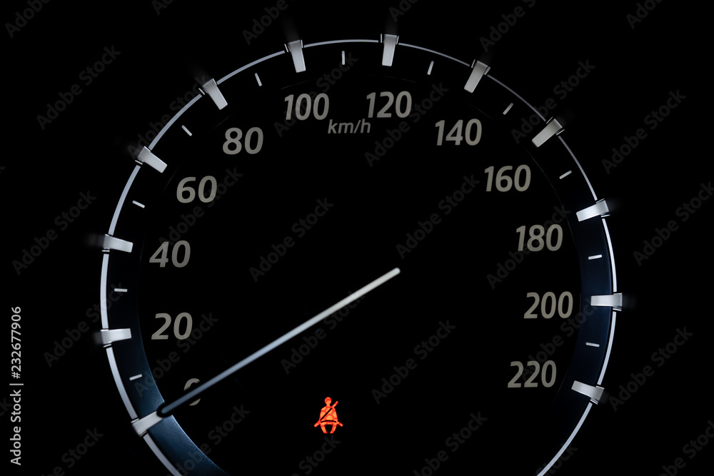 Car Dashboard showing the seat belt warning light. Close up. Car Dashboard showing the seat belt warning light. Close up.
