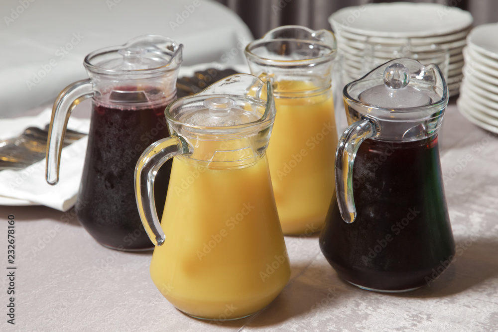 Yellow and red Glass Pitcher . yellow and red smoothie juice . Delicious orange juice in jug . uice in heavy glass jug Orange Yellow and red Glass Pitcher . yellow and red smoothie juice . Delicious orange juice in jug . uice in heavy glass jug Orange