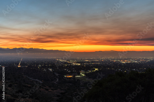 Los Angeles, California, USA - November 10, 2018: Smoke filled dawn sky above the San Fernando Valley. Smoke is from the Woolsey fire in Malibu and Ventura County. 