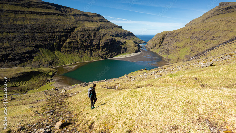 Girl exploring the beautiful highlands in Faroe Islands