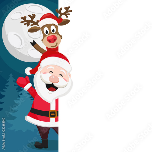 Santa Claus and a deer look out from behind the white shield. Place for text. © innafoto2017