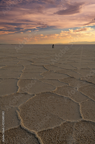Photographer at Bonneville Salt Flats with a dramatic sunset