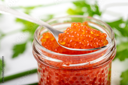 red caviar on the spoon closeup