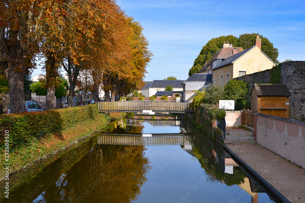 The Huisne river with reflection at La-Ferté-Bernard, a commune in the Sarthe department in the Pays de la Loire region in north-western France.