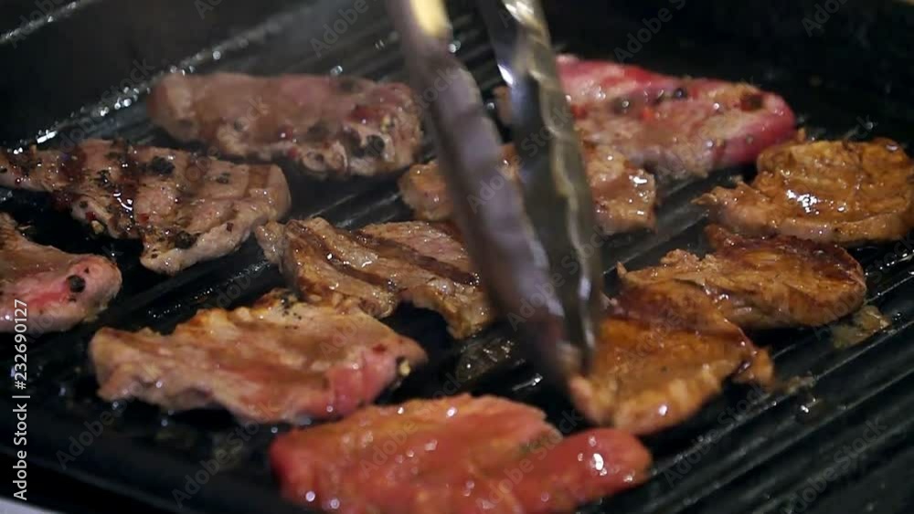 Cooking meat with spice, Chef preparing and spicing meat, Professional chef cooking, working and preparing meat restaurant kitchen, man at work as cook Cooking meat with spice, Chef preparing and spicing meat, Professional chef cooking, working and preparing meat restaurant kitchen, man at work as cook