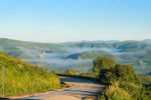 The mountain road from Serebryansk to Ust-Kamenogorsk in the early morning East Kazakhstan region, Kazakhstan photo