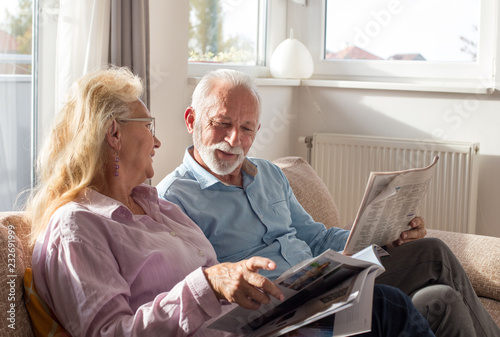 Senior couple reading at home