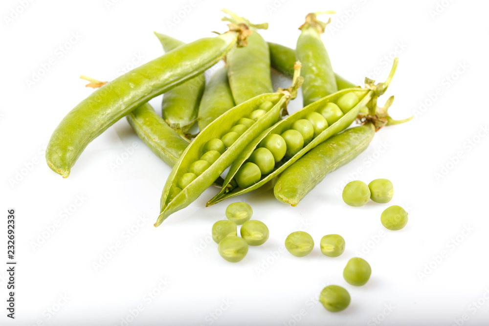 Green peas and pea pods on white background Green peas and pea pods on white background