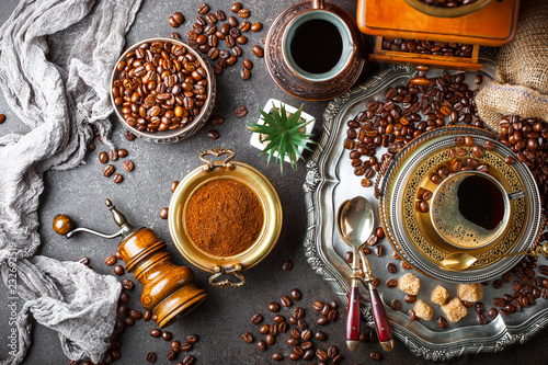 Black coffee in a composition with kitchen accessories