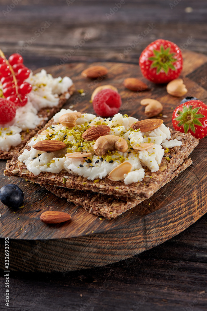 Fototapeta premium Sandwich with nuts and berrie Useful breakfast.