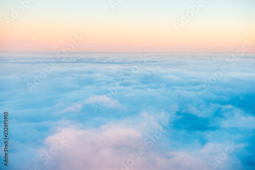 Sky and clouds at sunset, aerial view from plane