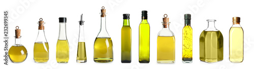 Photo Set with bottles of oil on white background