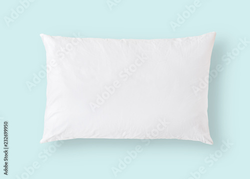 White pillow on blue background isolated with clipping path for bedding mockup design template photo