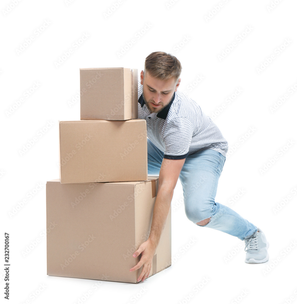 Full length portrait of young man lifting carton boxes on white background. Posture concept Full length portrait of young man lifting carton boxes on white background. Posture concept
