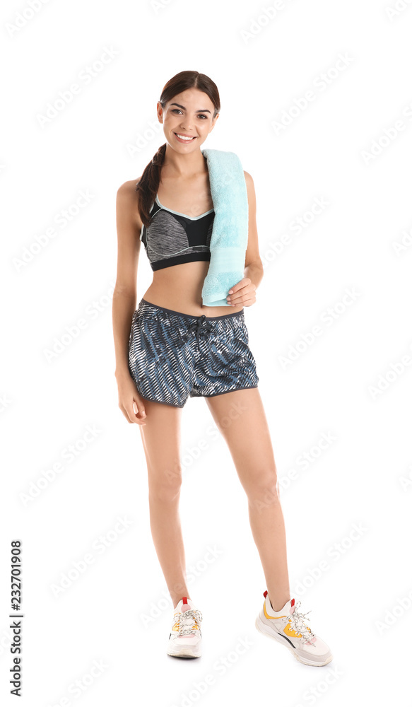 Beautiful young woman in sportswear with towel on white background Beautiful young woman in sportswear with towel on white background