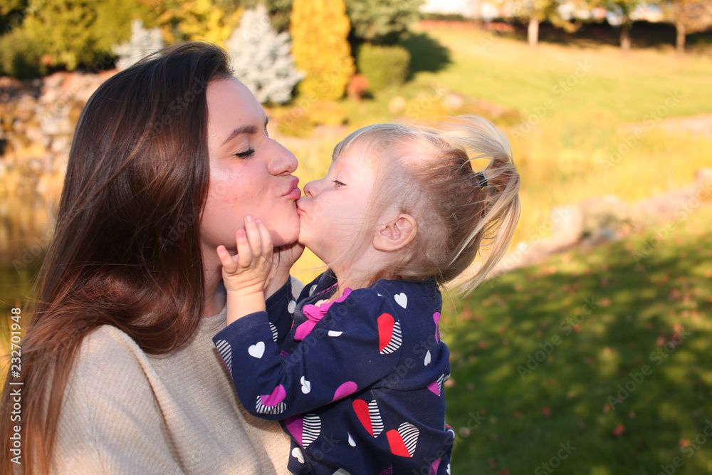 Close up, Portrait, Two Beautiful  Happy Sisters, in the park in the open air, Golden Autumn Background