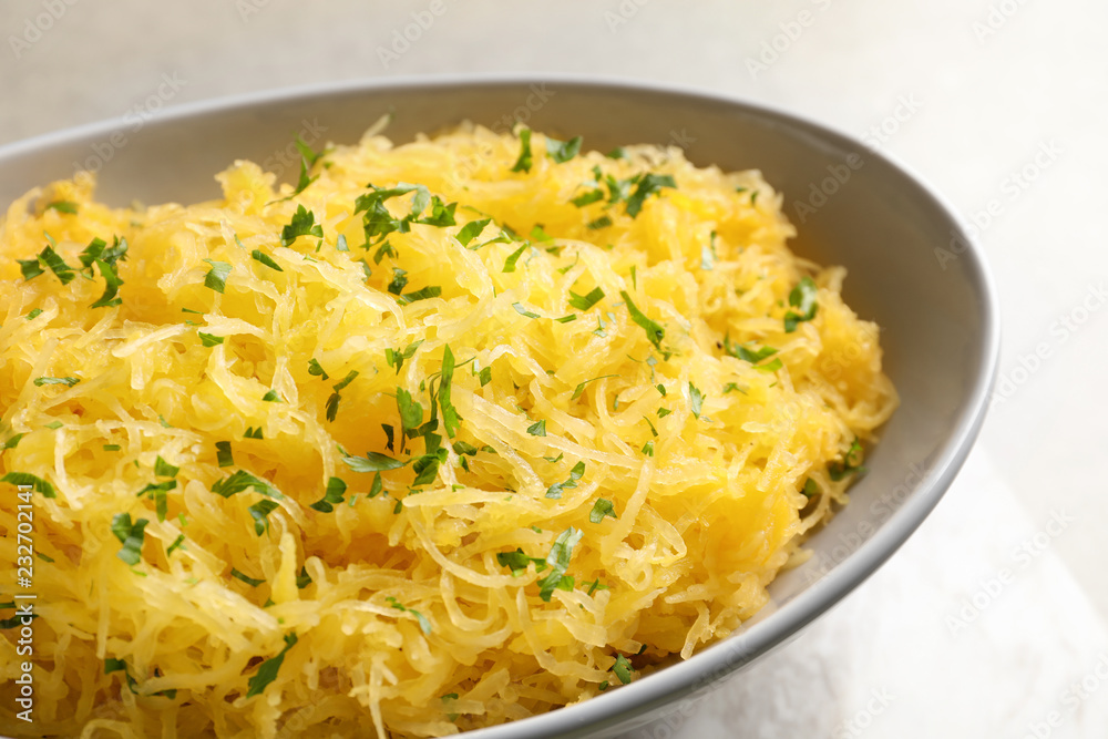 Bowl with cooked spaghetti squash on light background, closeup Bowl with cooked spaghetti squash on light background, closeup