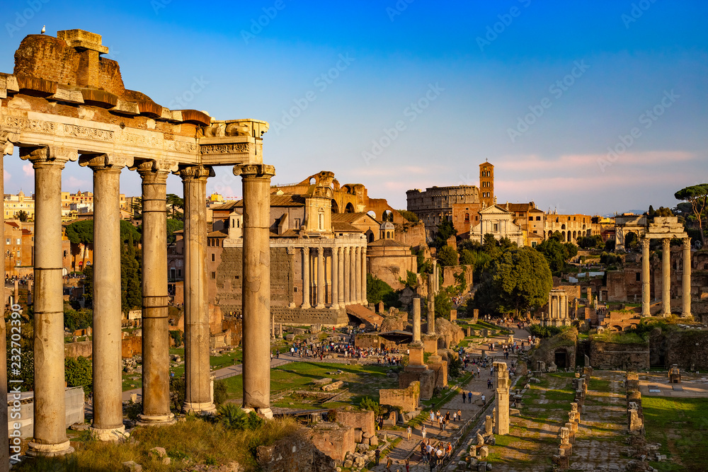 Italy. Rome. The Roman Forum (Forum Romanum) bathed in the sunset light. There is remains of the Temple of Saturn in the left