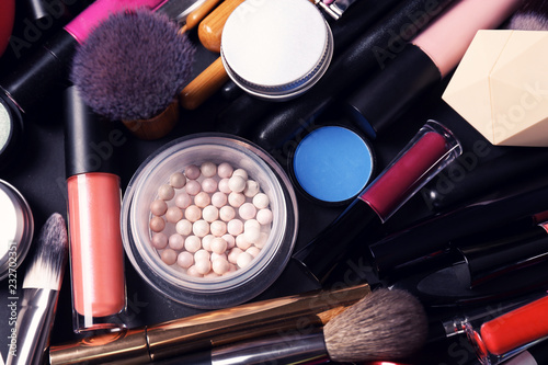 Set of different makeup products and tools as background, top view