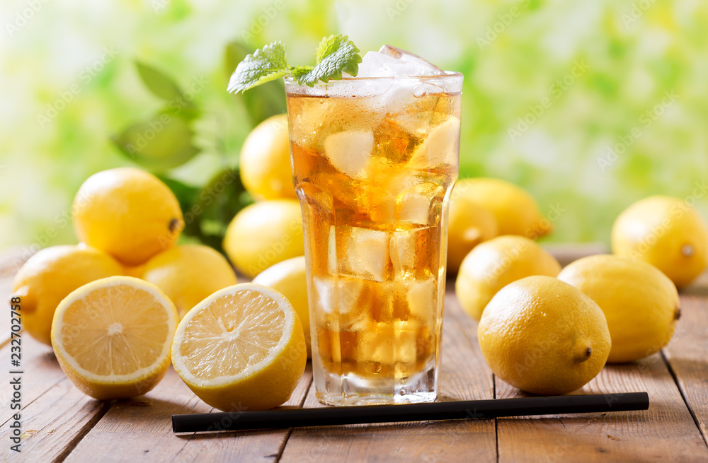 lemon iced tea in a glass with fresh fruits lemon iced tea in a glass with fresh fruits
