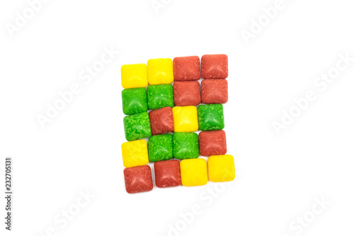 Colored candy laid out in a rectangle photo