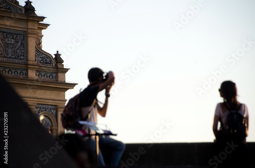 Soft focus on young couple photo shooting at Charles Bridge