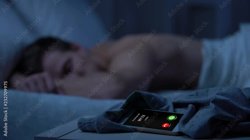 Ex calling, young man sleeping on background, missed call, broken relations