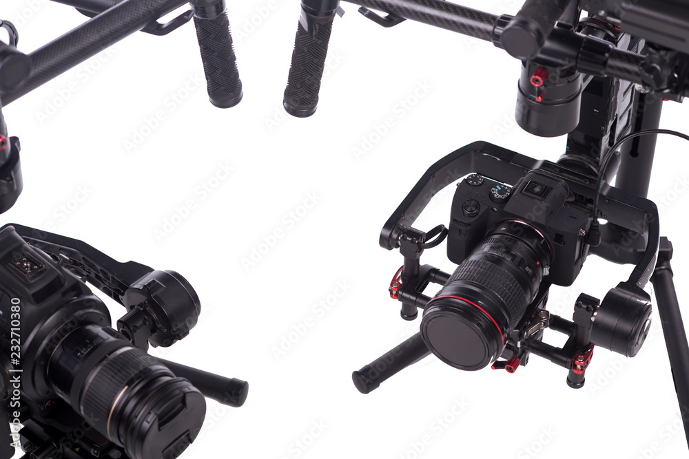 Sistem stabilization video camera and lens on steady equipment support such as gimbal steady or stabilized. White background Sistem stabilization video camera and lens on steady equipment support such as gimbal steady or stabilized. White background