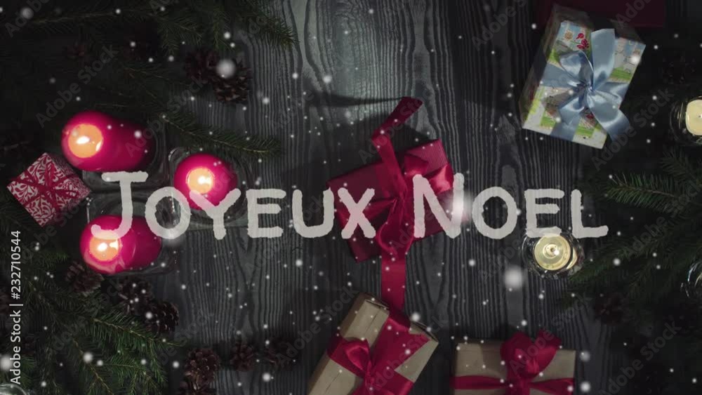 Animation Toyeux Noel - Merry Christmas in french, white letters, red candles and gifts, falling snow Animation Toyeux Noel - Merry Christmas in french, white letters, red candles and gifts, falling snow
