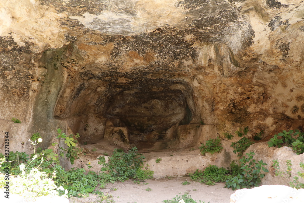 Caves dwellings in Parco Archeologico della Neapoli in Syracuse, Sicily Italy
