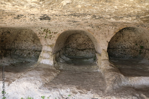 Caves dwellings in Parco Archeologico della Neapoli in Syracuse, Sicily Italy photo